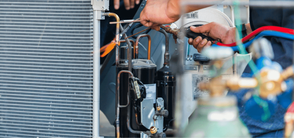 HVAC technician performing AC repair and maintenance on cooling system components in Mercedes, Texas.